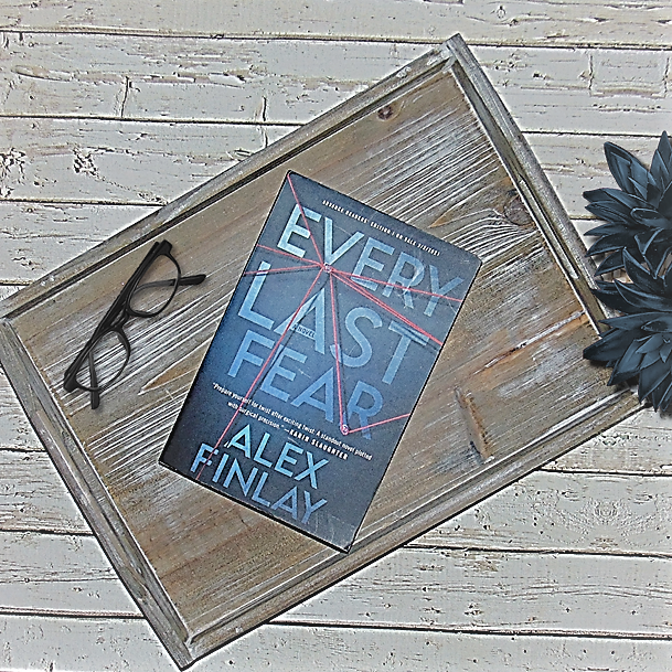 Every Last Fear book on wooden tray with glasses